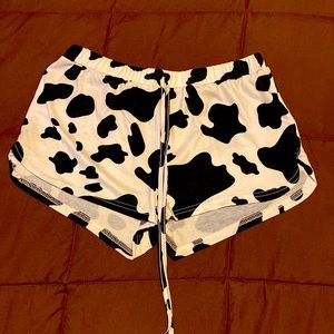 Size Large cow print running shorts